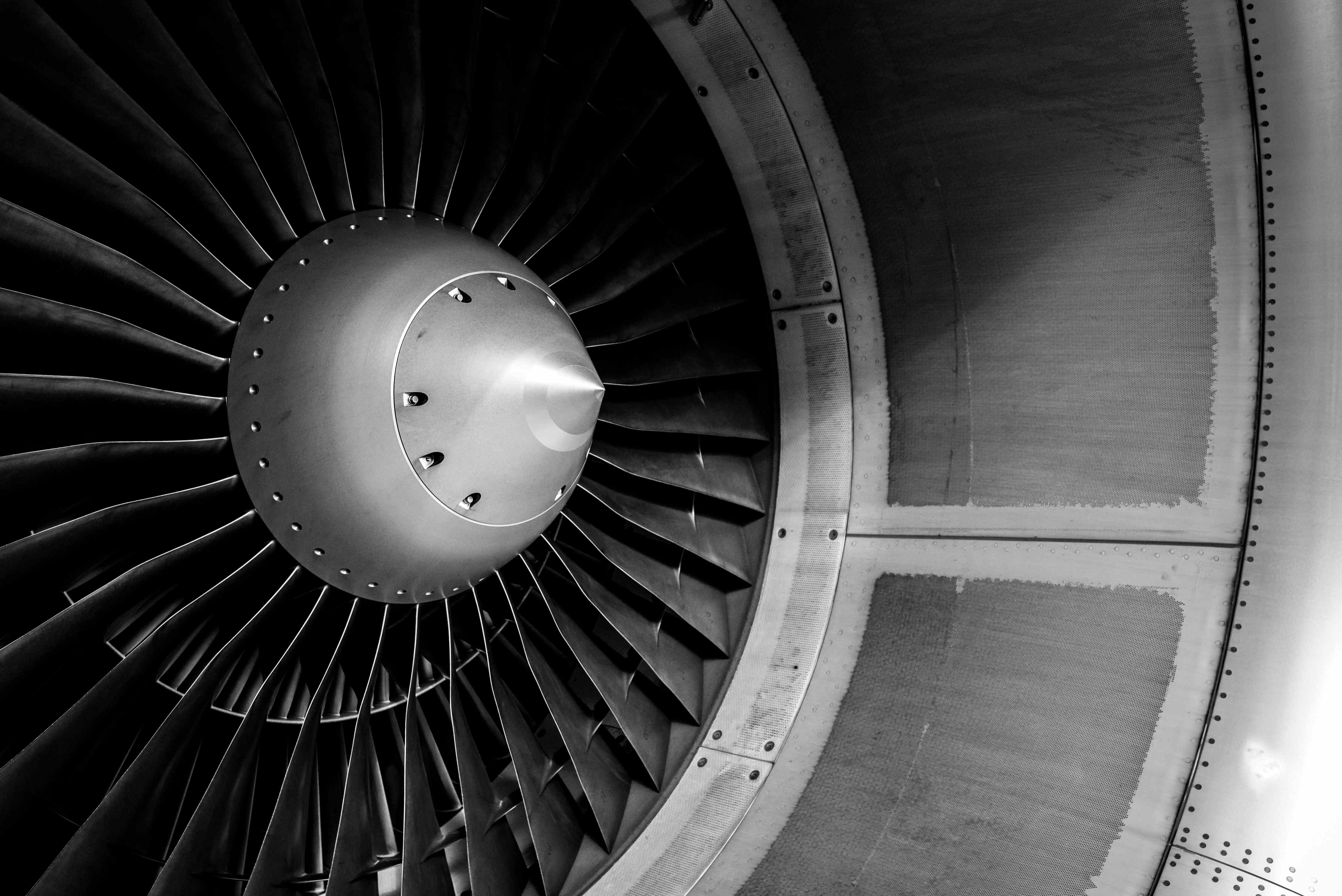 Blades of an aircraft engine close-up. Travel and aerospace concept. Black and white filter